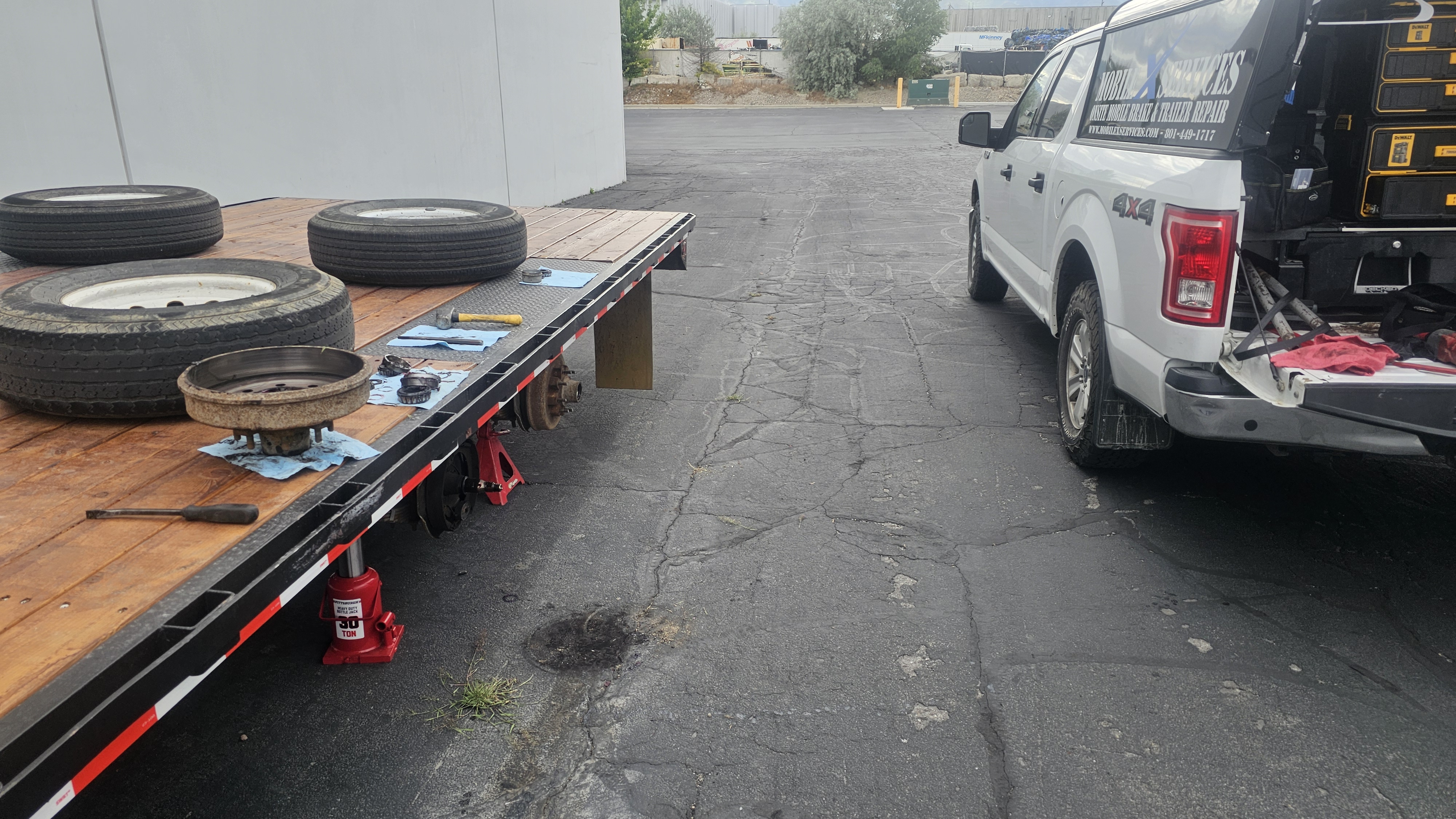 MobileXServices technician performing on-site trailer brake repair
